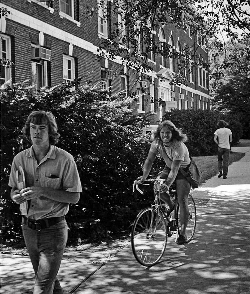 A student on a bike.