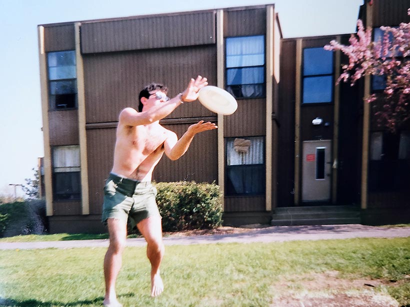 A student catching a frsibee.